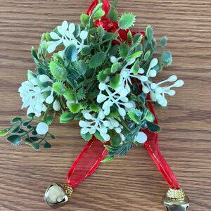 Hanging faux mistletoe ornament with jingle bells and red ribbon